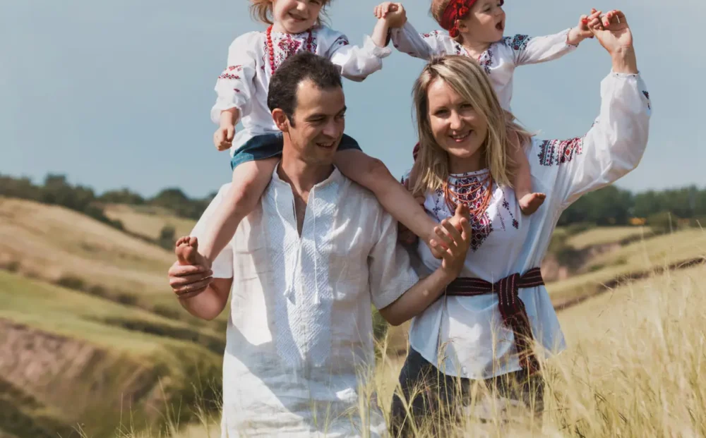 Ukrainian family at the  outdoor. dad, mom and two daughters in traditional national clothes vyshivanka