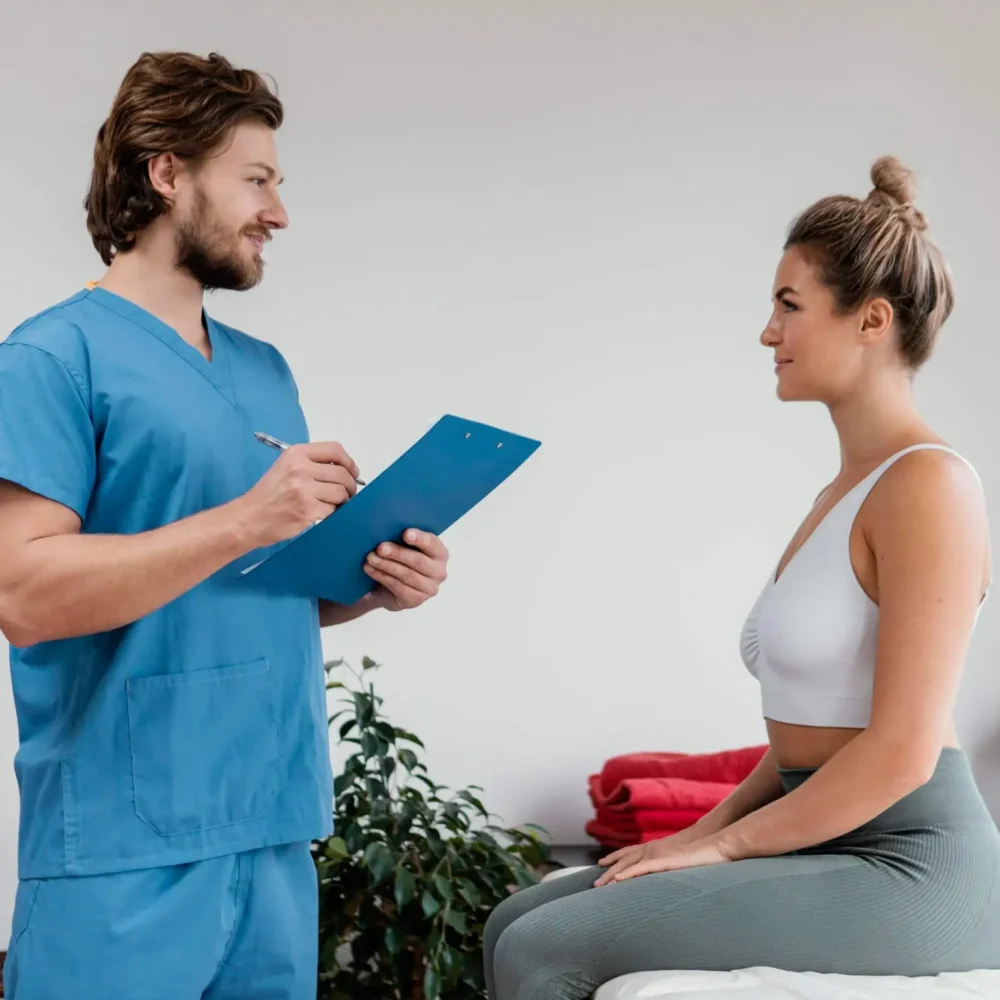 side-view-male-osteopathic-therapist-with-female-patient-signing-clipboard-clinic